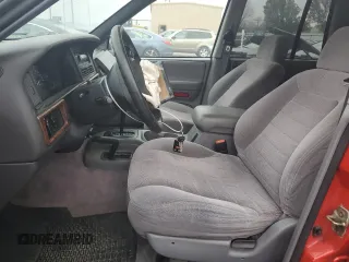 1996 Jeep Grand Cherokee Laredo with VIN 1J4GZ58S7TC292217, listed as a Copart auction lot 80757904 with 156,041 mi miles and Salvage Title. Bid and sale history available at carsss.com. Image 7.