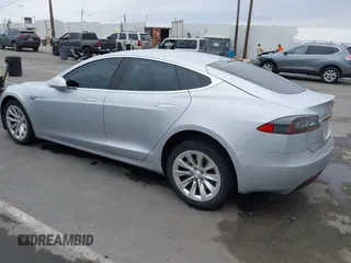 2016 Tesla Model S 90D with VIN 5YJSA1E23GF138925, listed as a IAAI auction lot 42408676 with 48,399 mi miles and . Bid and sale history available at DreamBid. Image 3.