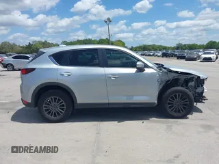 2017 Mazda CX-5 Sport with VIN JM3KFABLXH0135560, listed as a IAAI auction lot 42062016 with 153,416 mi miles. Bid and sale history available at carsss.com. Image 14.