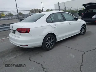 2016 Volkswagen Jetta Sedan 1.4T SE with VIN 3VWD67AJ6GM260584, listed as a IAAI auction lot 41903048 with 104,876 mi miles. Bid and sale history available at carsss.com. Image 4.