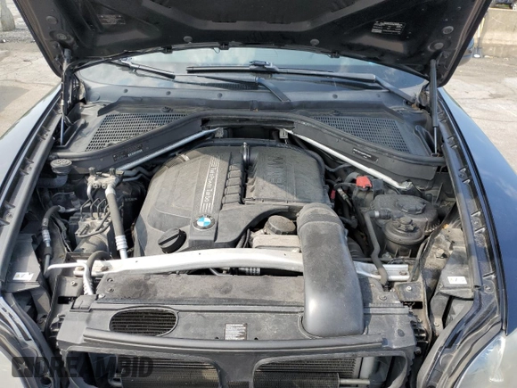 2012 BMW X5 35i with VIN 5UXZV4C59CL752661, listed as a Copart auction lot 58590305 with 101,725 mi miles and Salvage title. Bid and sale history available at DreamBid. Image 12.