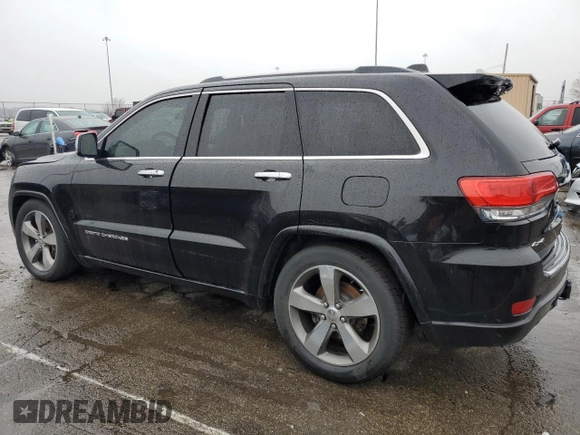 2015 Jeep Grand Cherokee Overland with VIN 1C4RJFCG7FC925995, listed as a Copart auction lot 85421214 with 142,266 mi miles and Salvage Title. Bid and sale history available at carsss.com. Image 2.