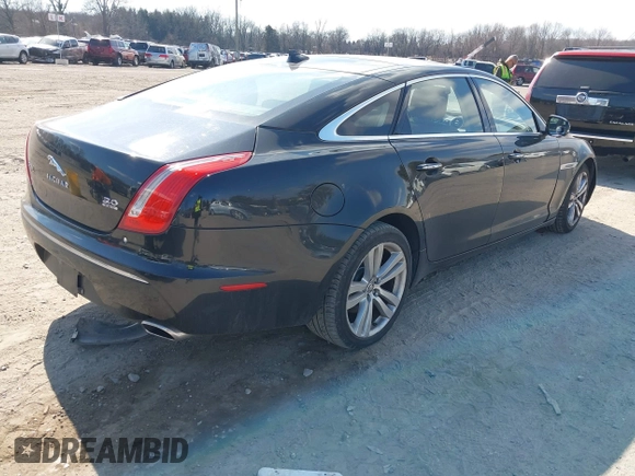 2013 Jaguar XJ Portfolio with VIN SAJWJ2GDXD8V55879, listed as a IAAI auction lot 41568366 with 121,119 mi miles and . Bid and sale history available at DreamBid. Image 4.