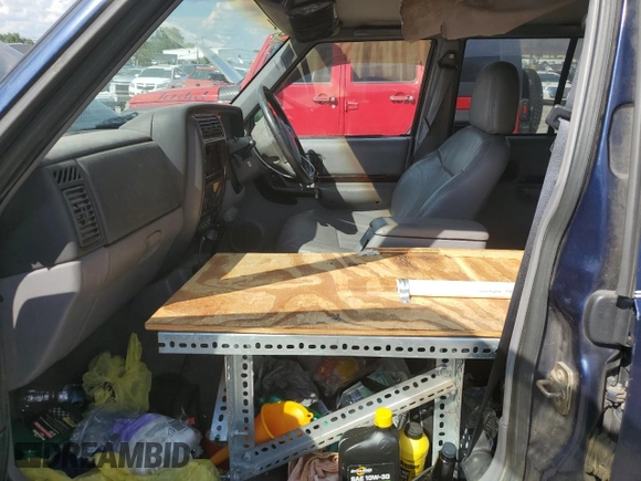 1997 Jeep Cherokee with VIN 1J4FN78S6VL604971, listed as a Copart auction lot 70690304 with 226,913 mi miles and Salvage title. Bid and sale history available at DreamBid. Image 7.