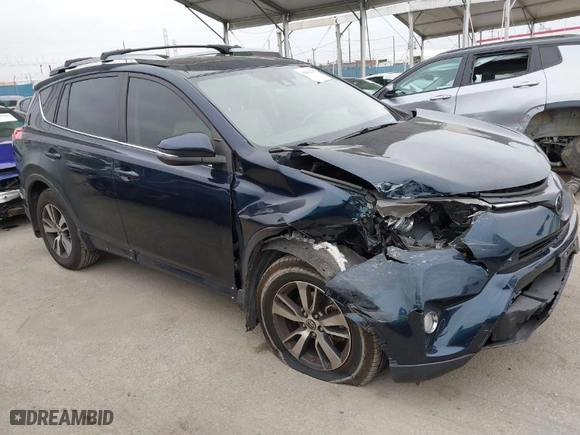 2018 Toyota RAV4 XLE with VIN JTMRFREV6JJ248098, listed as a IAAI auction lot 42042239 with 74,765 mi miles. Bid and sale history available at carsss.com. Image 1.