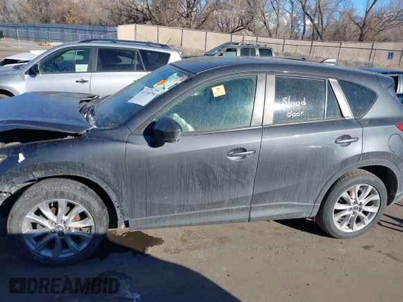 2014 Mazda CX-5 Grand Touring with VIN JM3KE2DY1E0421326, listed as a IAAI auction lot 41330794 with 127,589 mi miles. Bid and sale history available at carsss.com. Image 14.