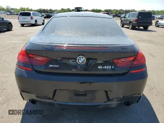 2015 BMW 6 Series z VIN WBALY1C57FDZ73541, wystawiony jako Copart lot #57294034 z przebiegiem 136 357 mil mil oraz Czysty tytuł • Clean title. Historia ofert i sprzedaży dostępna na DreamBid. Obrazek 6.