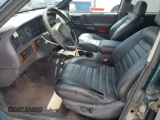 1996 Jeep Grand Cherokee Laredo z VIN 1J4GZ58S8TC222435, wystawiony jako Copart lot #62347665 z przebiegiem 202 125 mil mil oraz Czysty tytuł • Clean title. Historia ofert i sprzedaży dostępna na DreamBid. Obrazek 7.