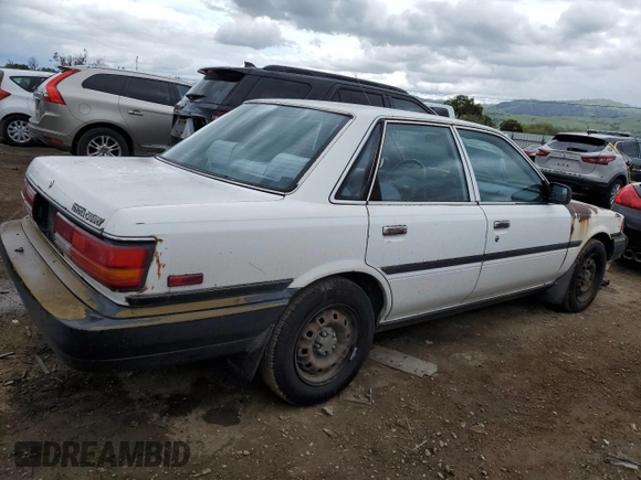 1991 Toyota Camry z VIN 4T1SV24E5MU355011, wystawiony jako Copart lot #51021185 z przebiegiem 135 881 mil mil oraz Czysty tytuł • Clean title. Historia ofert i sprzedaży dostępna na DreamBid. Obrazek 3.