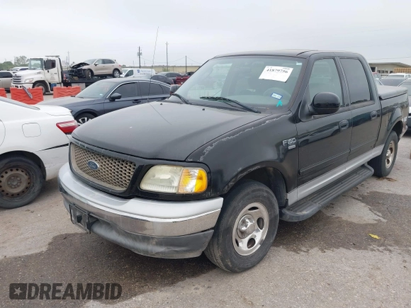 2003 Ford F-150 XLT with VIN 1FTRW07613KD14135, listed as a IAAI auction lot 41879756 with 197,515 mi miles. Bid and sale history available at carsss.com. Image 2.