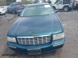 1999 Cadillac DeVille DHS with VIN 1G6KE54Y9XU766791, listed as a IAAI auction lot 42005553 with 140,515 mi miles. Bid and sale history available at carsss.com. Image 6.