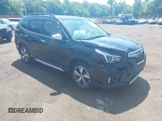 2019 Subaru Forester Touring with VIN JF2SKAWCXKH548345, listed as a IAAI auction lot 42553200 with 99,392 mi miles and . Bid and sale history available at DreamBid. Image 1.