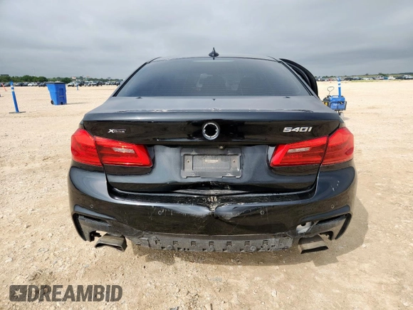 2018 BMW 5 Series 540i xDrive with VIN WBAJE7C52JWD52730, listed as a Copart auction lot 60297425 with 104,208 mi miles and Salvage title. Bid and sale history available at DreamBid. Image 6.