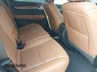 2021 Cadillac XT5 AWD Premium Luxury z VIN 1GYKNDRS8MZ217572, wystawiony jako IAAI lot #42190571 z przebiegiem 25 100 mil mil oraz . Historia ofert i sprzedaży dostępna na DreamBid. Obrazek 8.