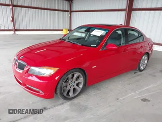 2007 BMW 3 Series 335i with VIN WBAVB73587P100572, listed as a IAAI auction lot 41409539 with 124,650 mi miles. Bid and sale history available at carsss.com. Image 2.