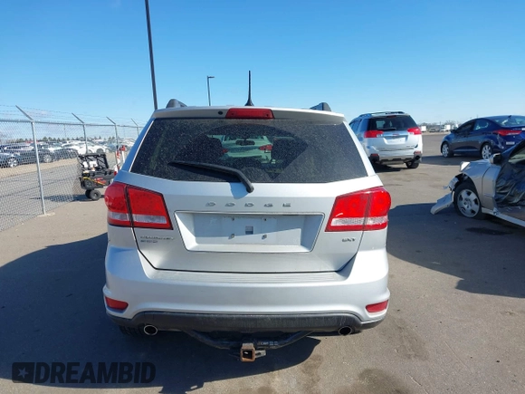 2013 Dodge Journey SXT with VIN 3C4PDDBG4DT506900, listed as a IAAI auction lot 42032379 with 130,911 mi miles and . Bid and sale history available at DreamBid. Image 16.