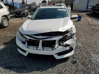 2018 Honda Civic EX с VIN 19XFC2F7XJE034358, выставлен на аукционе Copart как лот 43976415 с пробегом 117 514 миль миль и Списание • Salvage title. История ставок и продаж доступна на DreamBid. Изображение 14.