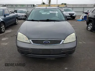 2005 Ford Focus S with VIN 3FAFP37N75R120187, listed as a Copart auction lot 57390605 with 163,547 mi miles and Salvage title. Bid and sale history available at DreamBid. Image 5.