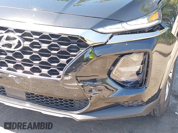2019 Hyundai Santa Fe SE with VIN 5NMS23AD4KH088902, listed as a IAAI auction lot 42044465 with 34,302 mi miles and . Bid and sale history available at DreamBid. Image 6.