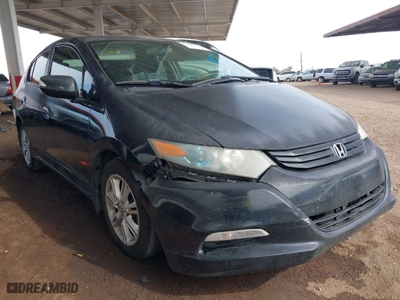 2011 Honda Insight EX with VIN JHMZE2H70BS011379, listed as a IAAI auction lot 41606111 with 220,543 mi miles. Bid and sale history available at carsss.com. Image 1.