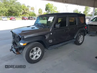 2020 Jeep Wrangler Unlimited Sport S with VIN 1C4HJXDN9LW167442, listed as a IAAI auction lot 42308617 with 59,335 mi miles and . Bid and sale history available at DreamBid. Image 18.