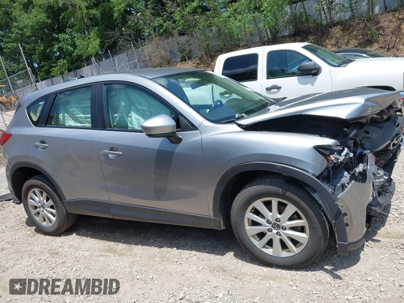 2014 Mazda CX-5 Sport with VIN JM3KE2BEXE0329303, listed as a IAAI auction lot 42556908 with 127,836 mi miles and . Bid and sale history available at DreamBid. Image 13.