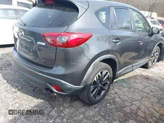 2016 Mazda CX-5 Grand Touring z VIN JM3KE4DY5G0836891, wystawiony jako IAAI lot #41441065 z przebiegiem 120 808 mil mil oraz . Historia ofert i sprzedaży dostępna na DreamBid. Obrazek 4.