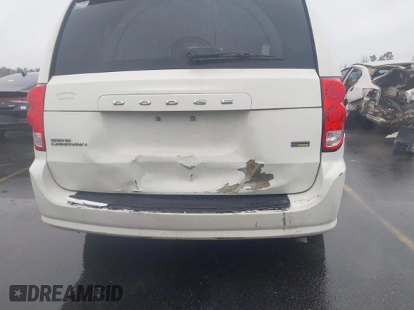 2012 Dodge Grand Caravan SXT with VIN 2C4RDGCG4CR304472, listed as a IAAI auction lot 41396437 with 180,309 mi miles and . Bid and sale history available at DreamBid. Image 6.