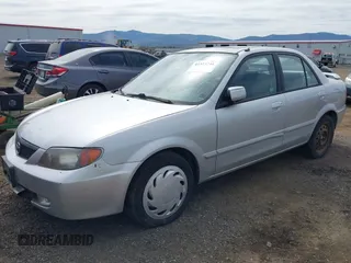 2002 Mazda Protege LX z VIN JM1BJ226X20523807, wystawiony jako IAAI lot #42373241 z przebiegiem 218 634 mil mil oraz . Historia ofert i sprzedaży dostępna na DreamBid. Obrazek 2.