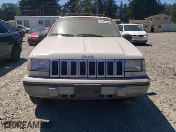 1994 Jeep Grand Cherokee Laredo with VIN 1J4GZ58Y7RC113333, listed as a Copart auction lot 57995734 with 220,950 mi miles and Clean Title. Bid and sale history available at carsss.com. Image 5.