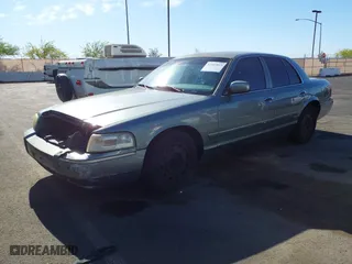 2006 Mercury Grand Marquis GS with VIN 2MEFM74V16X650056, listed as a IAAI auction lot 42107815 with 156,710 mi miles. Bid and sale history available at carsss.com. Image 2.