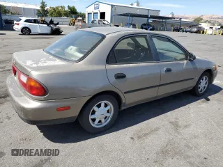 1998 Mazda Protege DX z VIN JM1BC1414W0203670, wystawiony jako Copart lot #62966544 z przebiegiem 249 405 mil mil oraz Szkoda całkowita • Salvage title. Historia ofert i sprzedaży dostępna na DreamBid. Obrazek 3.