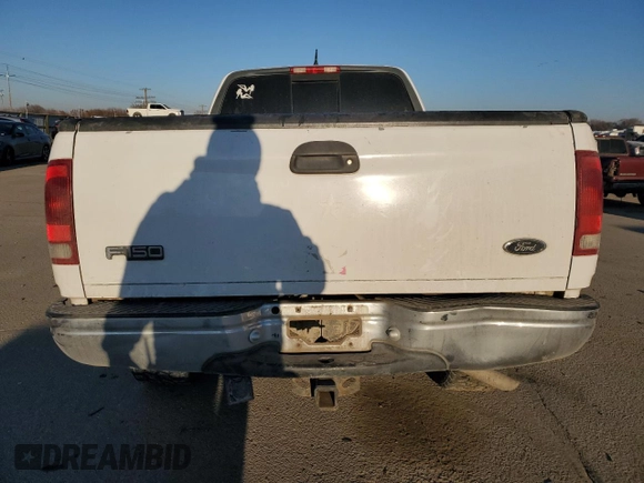2000 Ford F-150 XL with VIN 1FTRX18L3YKA09007, listed as a Copart auction lot 42828005 with 218,563 mi miles and Salvage Title. Bid and sale history available at carsss.com. Image 6.