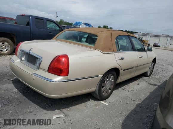 2003 Lincoln Town Car Cartier z VIN 1LNHM83W33Y690270, wystawiony jako Copart lot #51682235 z przebiegiem 118 355 mil mil oraz Szkoda całkowita • Salvage title. Historia ofert i sprzedaży dostępna na DreamBid. Obrazek 3.