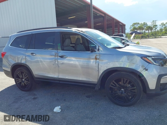 2022 Honda Pilot Special Edition with VIN 5FNYF5H25NB034822, listed as a IAAI auction lot 40341057 with 25,931 mi miles and . Bid and sale history available at DreamBid. Image 6.