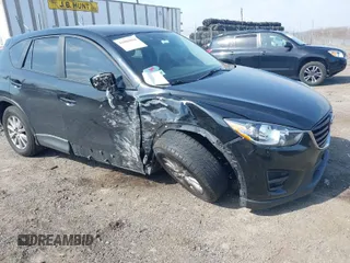 2016 Mazda CX-5 Sport with VIN JM3KE4BY3G0843177, listed as a IAAI auction lot 41804094 with 193,461 mi miles. Bid and sale history available at carsss.com. Image 1.