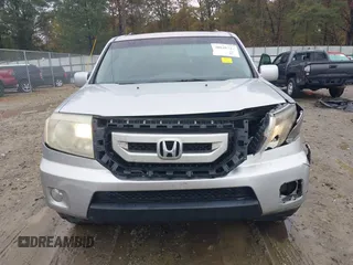 2010 Honda Pilot Touring with VIN 5FNYF3H89AB005861, listed as a IAAI auction lot 40828747 with 275,757 mi miles and . Bid and sale history available at DreamBid. Image 6.