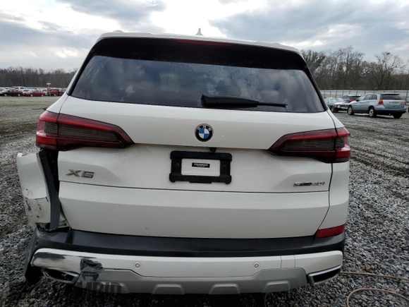 2021 BMW X5 sDrive40i with VIN 5UXCR4C04M9E30879, listed as a Copart auction lot 39577953 with 19,276 mi miles. Bid and sale history available at carsss.com. Image 6.