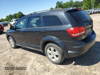 2013 Dodge Journey SE with VIN 3C4PDCAB5DT729415, listed as a Copart auction lot 55851915 with 128,782 mi miles and Salvage title. Bid and sale history available at DreamBid. Image 2.