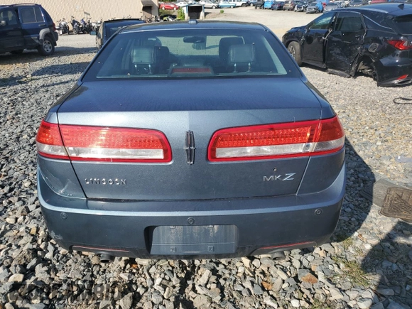 2012 Lincoln MKZ z VIN 3LNHL2GCXCR827302, wystawiony jako Copart lot #70519604 z przebiegiem 150 416 mil mil oraz Szkoda całkowita • Salvage title. Historia ofert i sprzedaży dostępna na DreamBid. Obrazek 6.