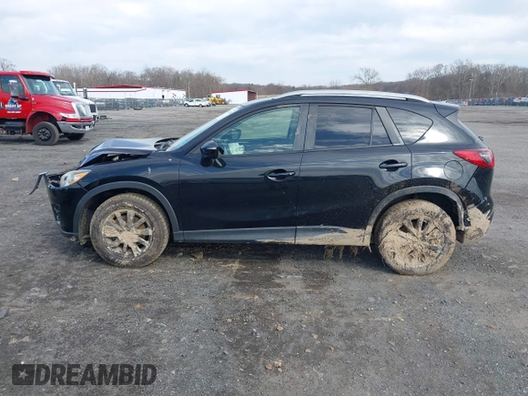 2016 Mazda CX-5 Touring with VIN JM3KE4CY7G0602267, listed as a IAAI auction lot 41854213 with 134,170 mi miles and . Bid and sale history available at carsss.com. Image 14.