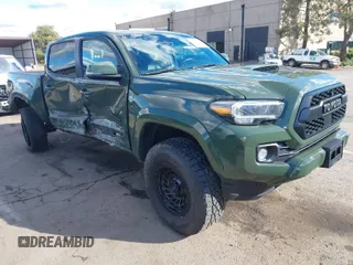 2021 Toyota Tacoma SR z VIN 3TMCZ5AN4MM401998, wystawiony jako IAAI lot #41712813 z przebiegiem 91 371 mil mil oraz . Historia ofert i sprzedaży dostępna na DreamBid. Obrazek 1.