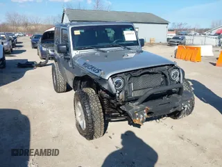 2016 Jeep Wrangler Sport z VIN 1C4GJWAG6GL146356, wystawiony jako IAAI lot #41890285 z przebiegiem 83 363 mil mil oraz . Historia ofert i sprzedaży dostępna na DreamBid. Obrazek 1.