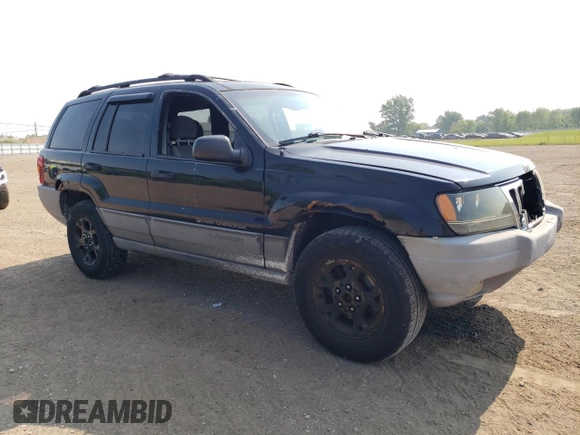 2000 Jeep Grand Cherokee Laredo with VIN 1J4GW48S6YC404063, listed as a Copart auction lot 59442725 with 268,543 mi miles and Salvage title. Bid and sale history available at DreamBid. Image 4.