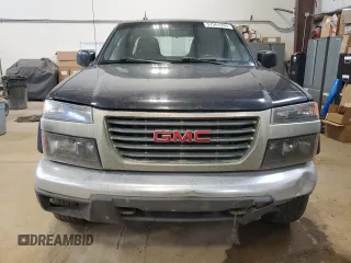 2009 GMC Canyon Work Truck z VIN 1GTDT19E798132510, wystawiony jako Copart lot #57361995 z przebiegiem 240 338 mil mil oraz Czysty tytuł • Clean title. Historia ofert i sprzedaży dostępna na DreamBid. Obrazek 5.