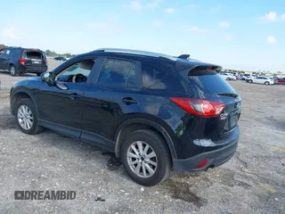 2014 Mazda CX-5 Touring with VIN JM3KE2CYXE0384987, listed as a IAAI auction lot 42052196 with 151,765 mi miles. Bid and sale history available at carsss.com. Image 3.
