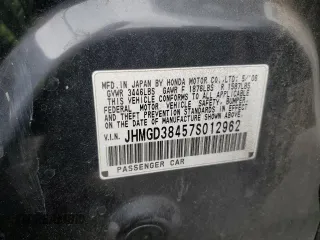2007 Honda Fit z VIN JHMGD38457S012962, wystawiony jako Copart lot #55927755 z przebiegiem 172 153 mil mil oraz Szkoda całkowita • Salvage title. Historia ofert i sprzedaży dostępna na DreamBid. Obrazek 12.