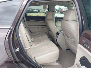 2015 Cadillac SRX Luxury Collection z VIN 3GYFNBE35FS597538, wystawiony jako IAAI lot #42056002 z przebiegiem 49 483 mil mil oraz . Historia ofert i sprzedaży dostępna na DreamBid. Obrazek 8.