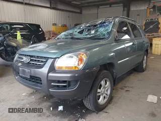 2006 Kia Sportage LX z VIN KNDJF723867179116, wystawiony jako IAAI lot #41964701 z przebiegiem 112 380 mil mil oraz . Historia ofert i sprzedaży dostępna na DreamBid. Obrazek 2.