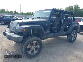 2016 Jeep Wrangler Unlimited Sahara with VIN 1C4BJWEG8GL333876, listed as a IAAI auction lot 42314351 with 163,889 mi miles and . Bid and sale history available at DreamBid. Image 2.